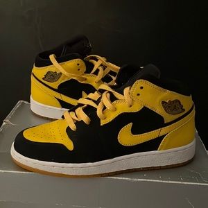Black and yellow Jordan 1s